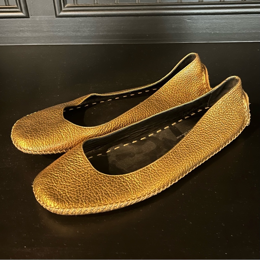 Gold-metallic ballet-flats with sporty driving-moccasin soles by Taryn Rose
